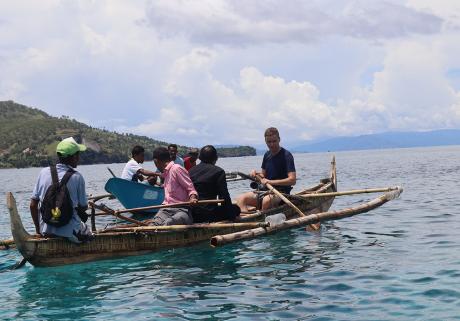 Rowing the traditional boat from the Island