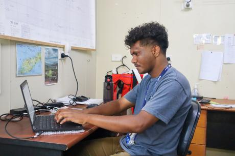 A man typing on a computer